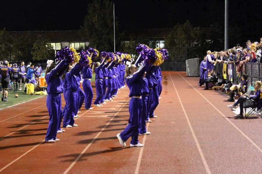 The cheer program performs during the Homecoming game