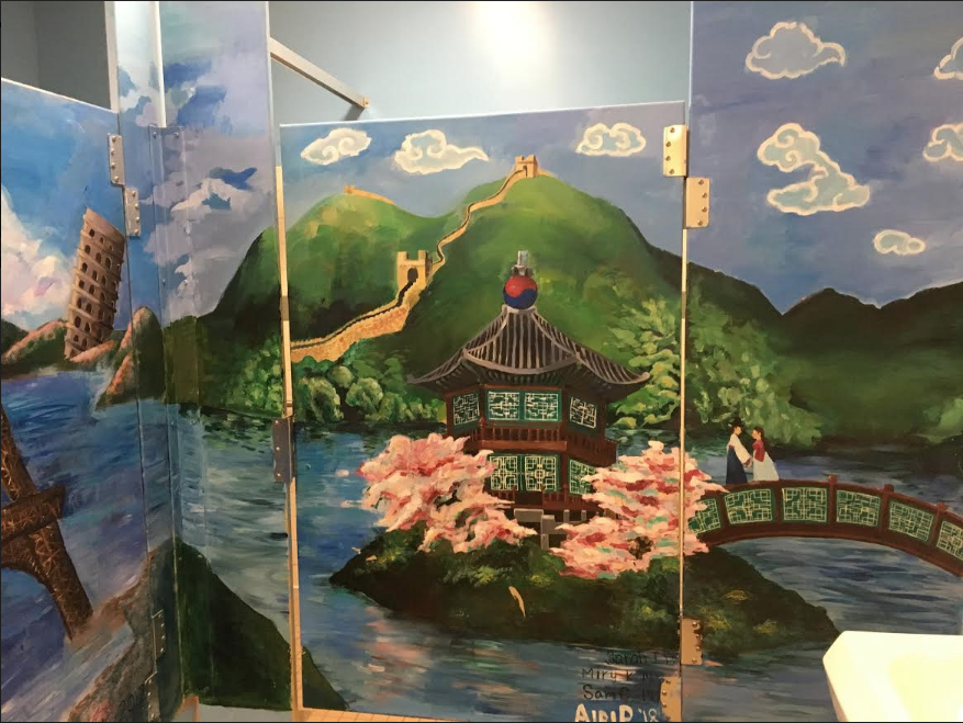 Airi Pan '18 has been working hard to restore the peeling mural in the girls bathroom.