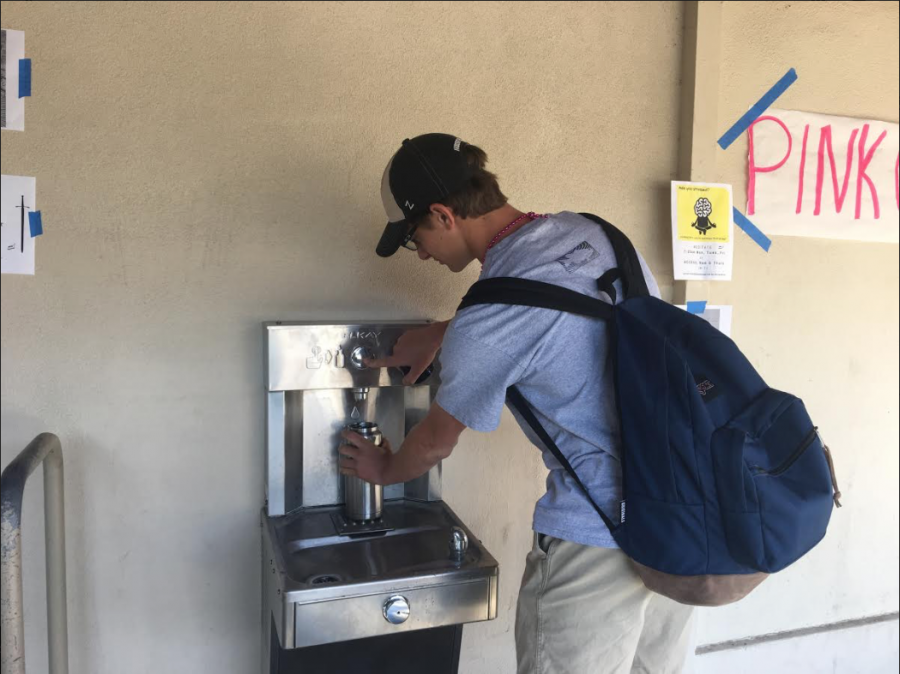 Michael Cassetti (19) fills up his Yeti water bottle at one of the hydration stations here on campus.