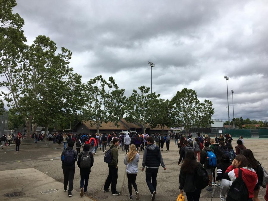 Students were evacuated to the field after the fire alarm was pulled during lunch.