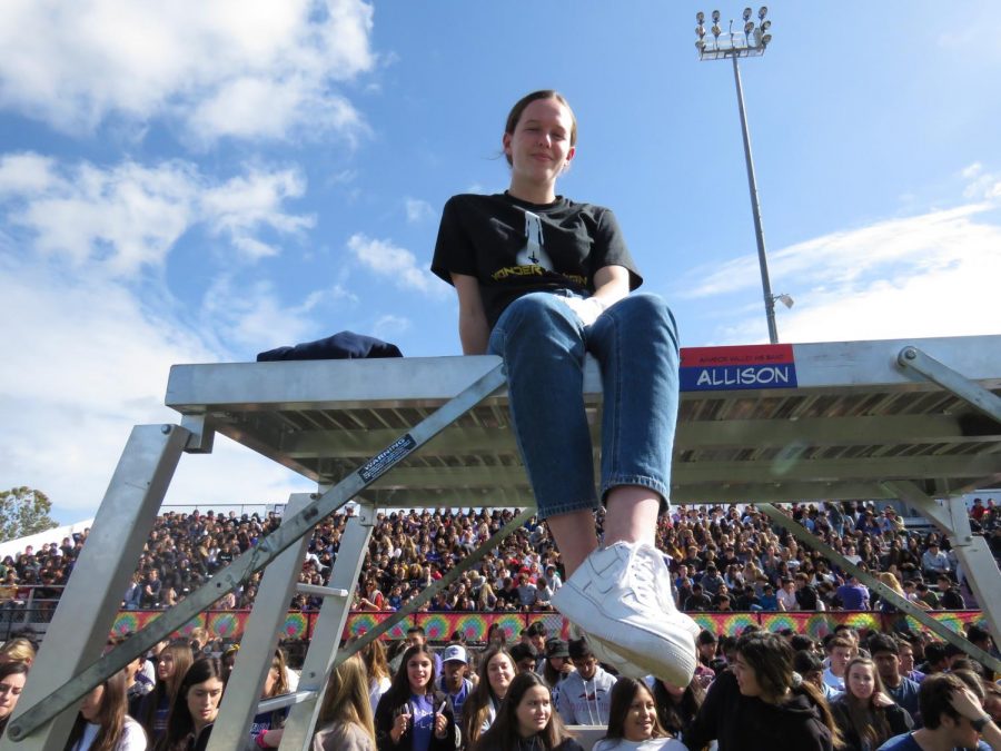 Alison Gable, drum leader, sits and rests after a long rally of conducting her band. 