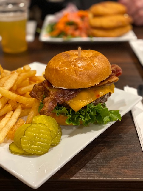 The mouthwatering Bacon-Cheeseburger with a side of fries in Pleasantons new restaurant, Patio. 