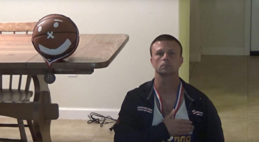 Track Coach Jason Oswalt at the Corona Indoor Nationals Awards Ceremony depicting his loss to Spaulding, the basketball, at the high jumps.