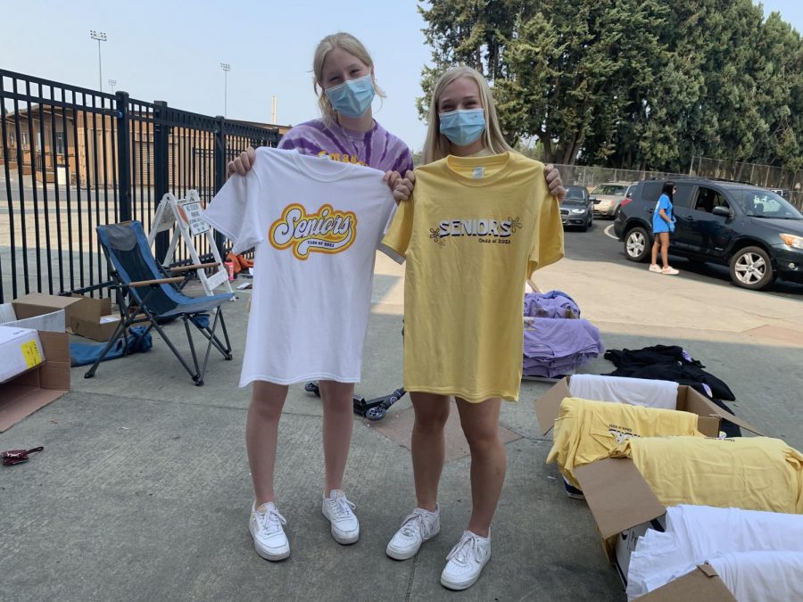 Katie Jones (21) and Hannah Kramer (21) hold the new senior shirts.