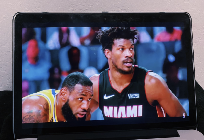 LeBron James and Jimmy Butler guard one another in Game 4, their eyes on the ball as it is thrown into play.