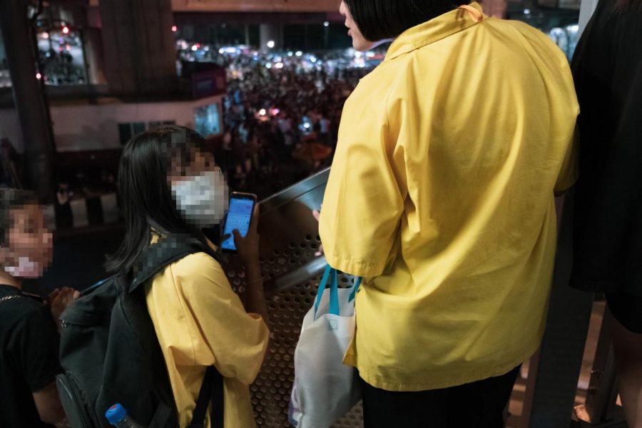 Local high school students watch the protest unfold. 