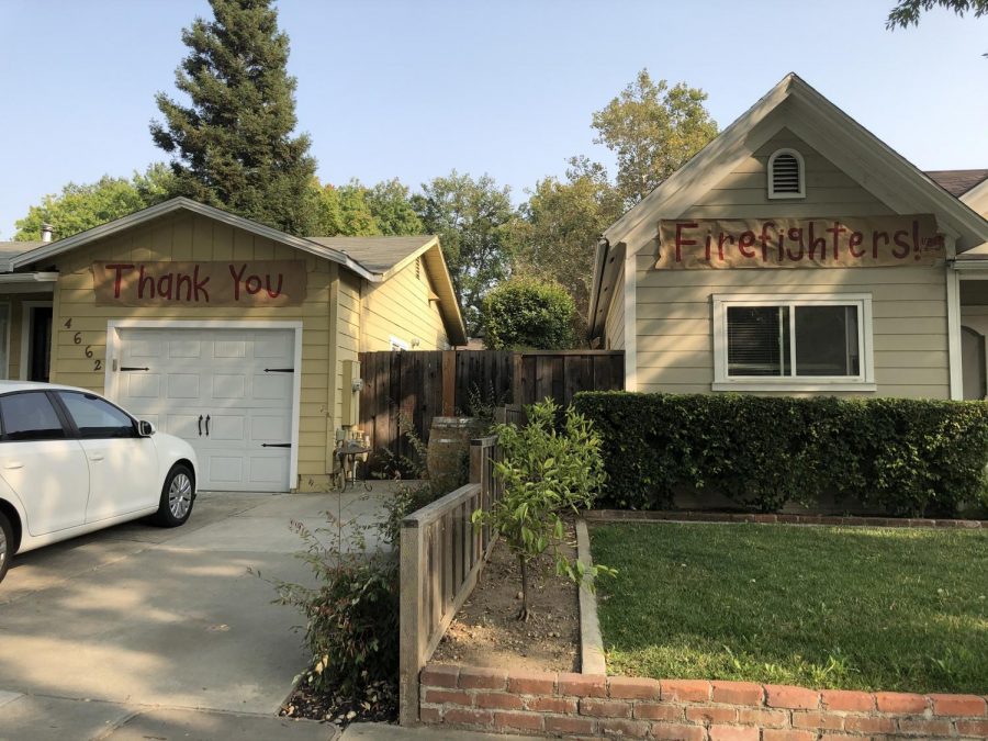 Houses put up banners to communicate their thanks for firefighters' work during trying times.