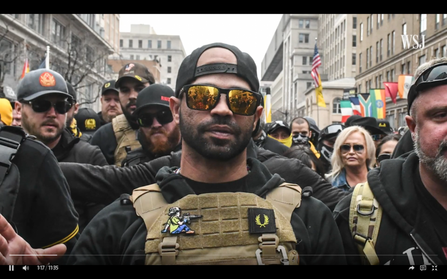 Enrique Tarrio, leader of the Proud Boys, guides the rest of his group members through a protest.