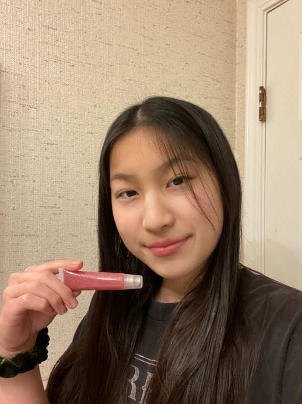 Defy Cosmetics co-founder Jane Wu displays one of the companys lip glosses.