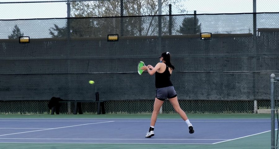 Angelina Ma ('22) jumps to receive the opponent's ball, making sure that she doesn't lose the point.