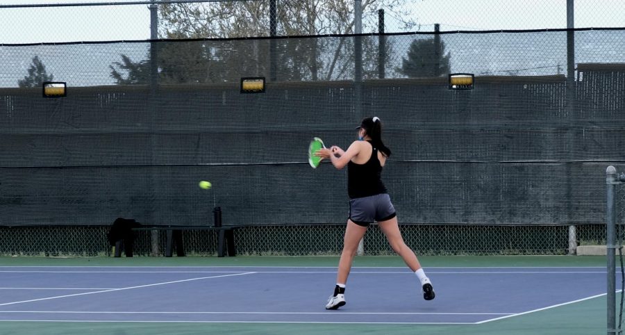 Angelina Ma (22) jumps to receive the opponents ball, making sure that she doesnt lose the point.