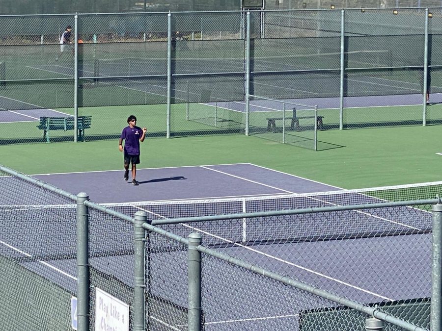 Sunny Mukherjee (21), Varsity Singles Player, takes a break from his efforts in his matches against Dublin. 