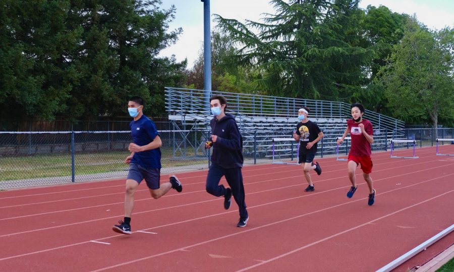 Justin Corpuz (22), Peter Sanchez (22), and Joe Dai (23) work on their speed during practice. 