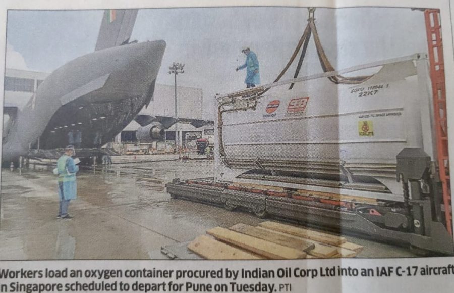 Workers load an oxygen container procured by Indian Oil Corp Ltd into an IAF C-17 aircraft in Singapore scheduled to depart for Pune on Tuesday. 
