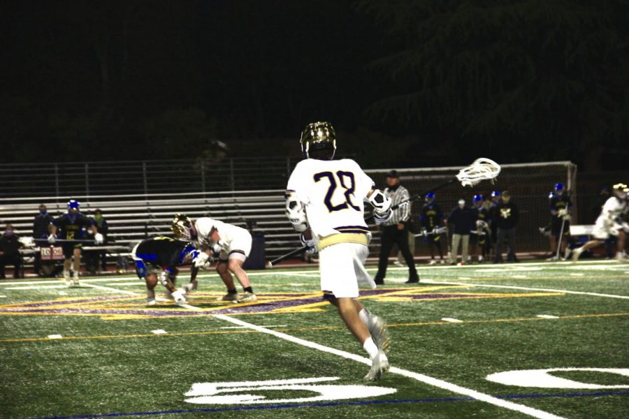 #28 Max Quarneri ('23) dash in at the start of a play.
