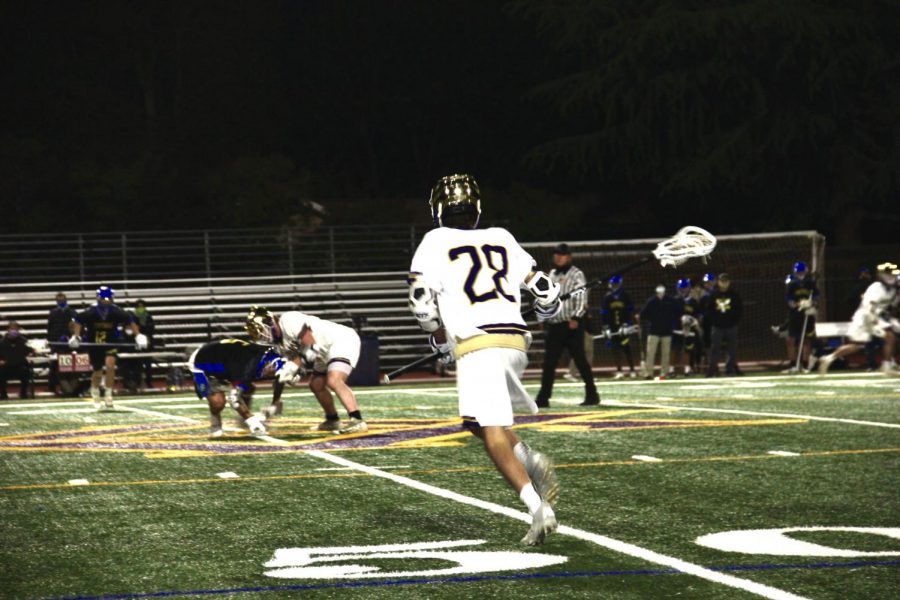 #28 Max Quarneri (23) dash in at the start of a play.
