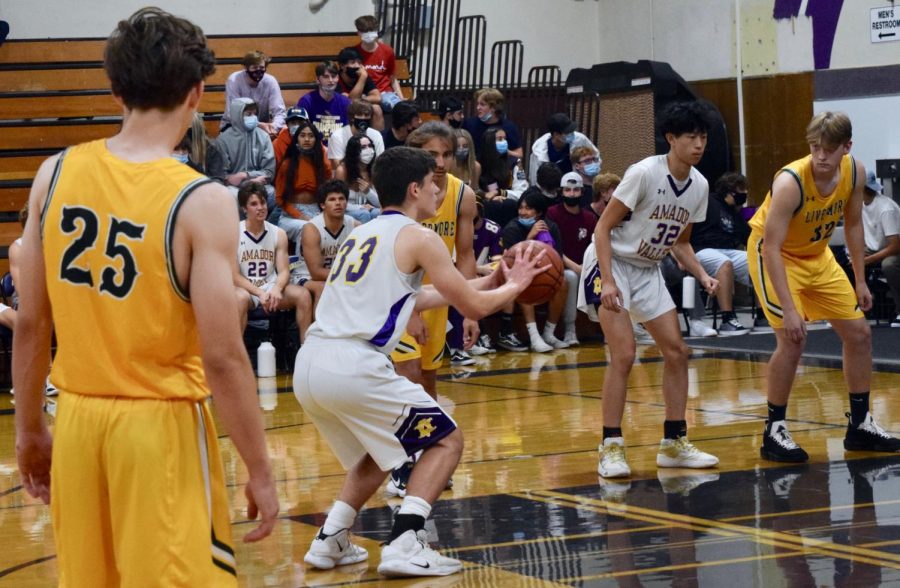 As the game grows tense, Javier Gros-Suarez (23) prepares hard to shoot his free throw. 