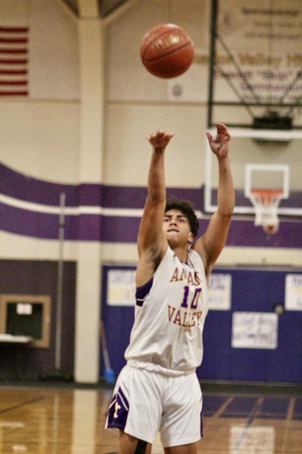 After getting fouled, DJ Miranda (21) shoots for a free point.