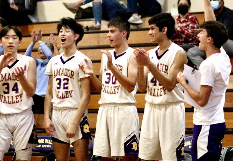 Jesse Huang ('23), Jason Ooi ('23), Abe Tabatabaian ('22), Yash Maheshwaran ('21) and Trevor Cheng ('21) cheer on their teammates on the court.