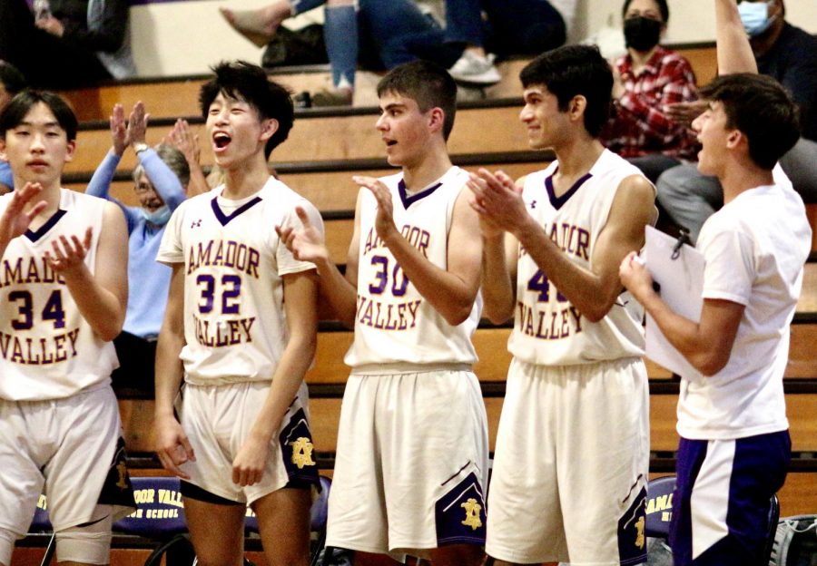 Jesse Huang (23), Jason Ooi (23), Abe Tabatabaian (22), Yash Maheshwaran (21) and Trevor Cheng (21) cheer on their teammates on the court.