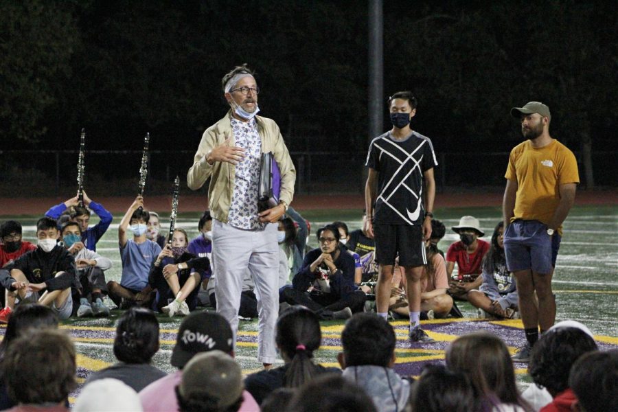 Band directors chat with the students after practice on their performance, reflecting on what they could do better.