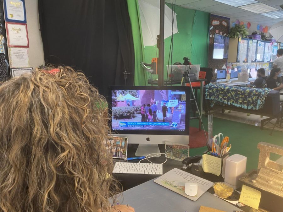 Teachers watch as news sources describe the new mandate that Newsom recently announced.