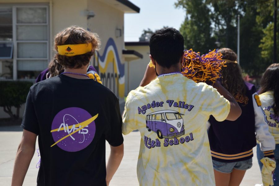 The group is covered in Amador shirts, colors, and accessories, ready to tell everybody about the football game against Bear Creek.