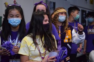 With Amador T-shirts in their hands, the team toss them to students while running around giving announcements.