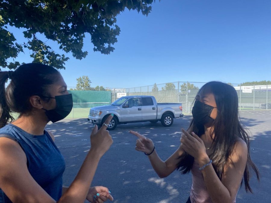 Lois Hong ('22) and Juhi Goyal ('24) laugh together after a long day at school. This year students have banded together and expanded their social horizons.