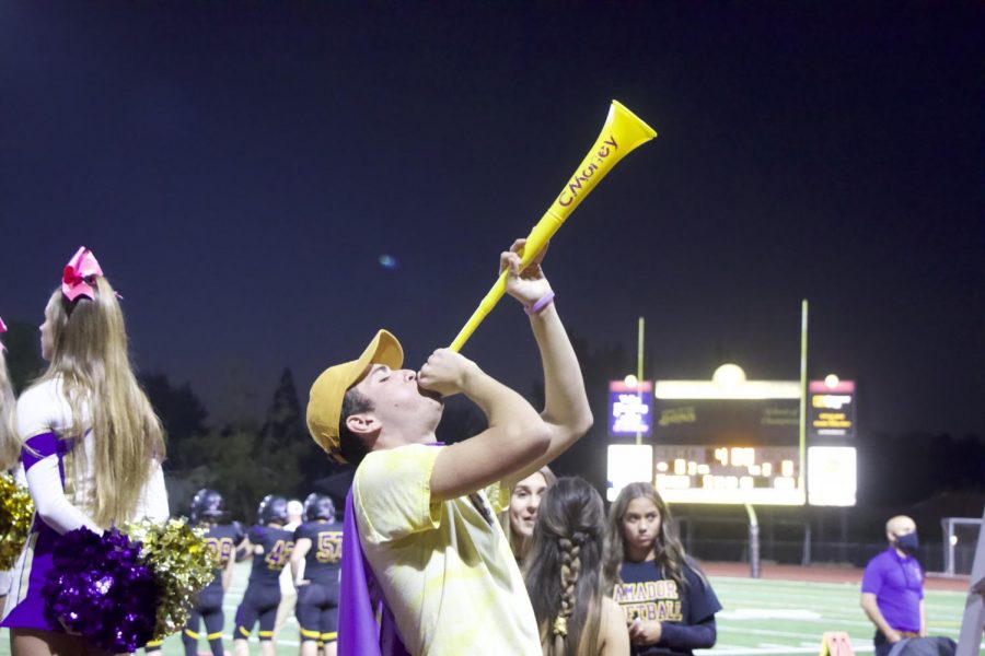Carson Candler (22) shows his don squad spirt hyping up the purple pit.