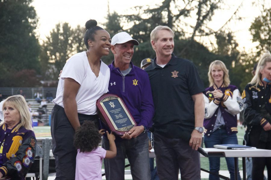 Baseball Coach Cesario presents new Wall of Fame with their Wall of Fame plaque.