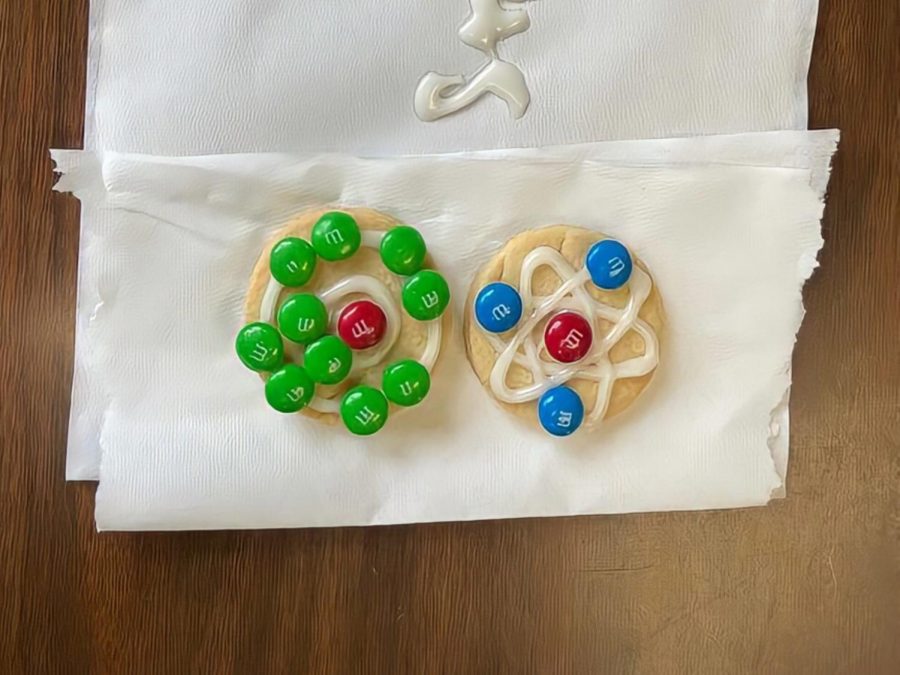 Chemistry students modeled various elements with the help of sugar cookies, frosting, and M&Ms.