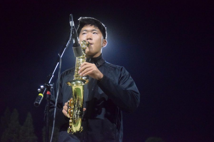 Ian Hwang ('22), part of Amador Marching Band performs at half time, ready to blow the field away with their harmonious sound and skilled colorguard.