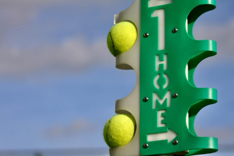 To help keep tennis practices running smoothly, holders at the side keep spare balls in reserve.