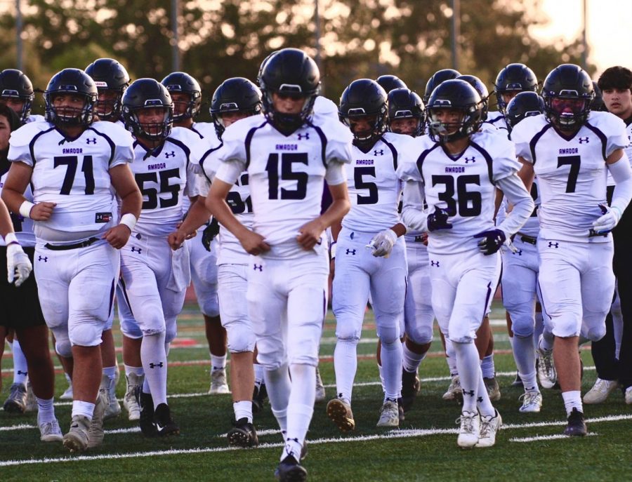 Amador football jogs back after their warmup sprint across the field.