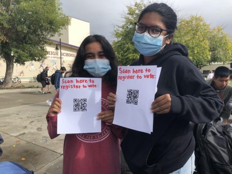 Amador seniors held up flyers to sign up people to vote.