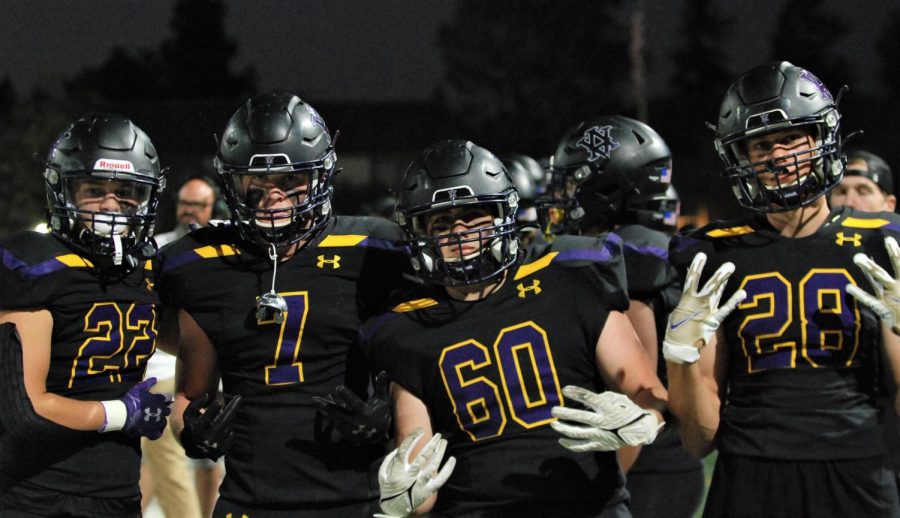 Four players pose for the camera.