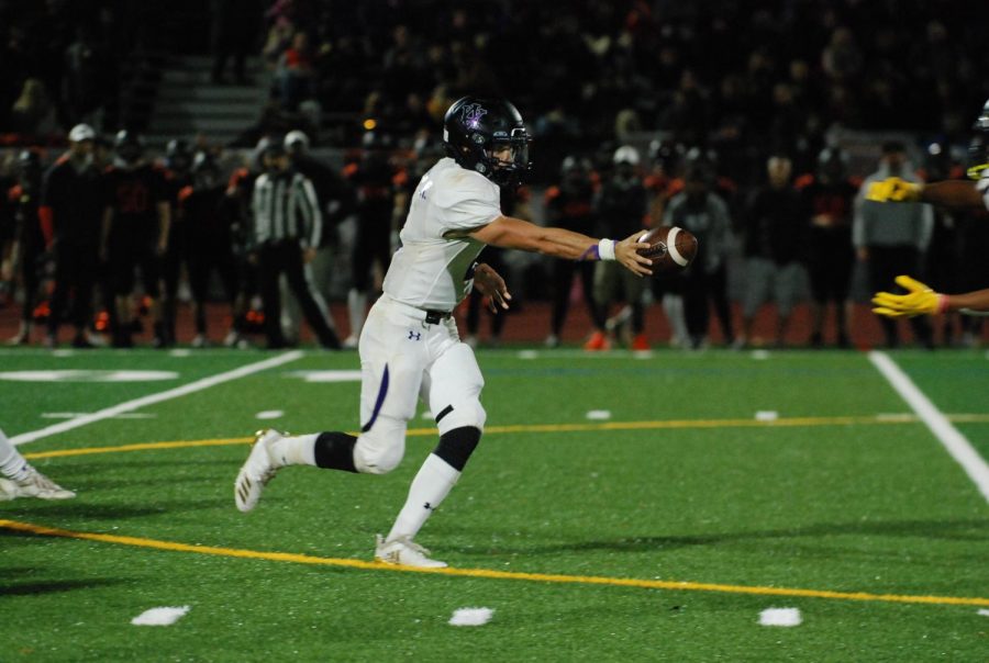 An Amador player catches the football with lightning-quick reflexes.