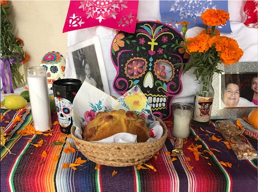 Pan de Muertos, or “Bread of the Dead,” is a type of sweet bread that is baked for Dia de Los Muertos, the strips placed on top representing bones and skulls. The prevalence of ornate skulls also welcomes lost souls from the spirit realm to return to the living world. 