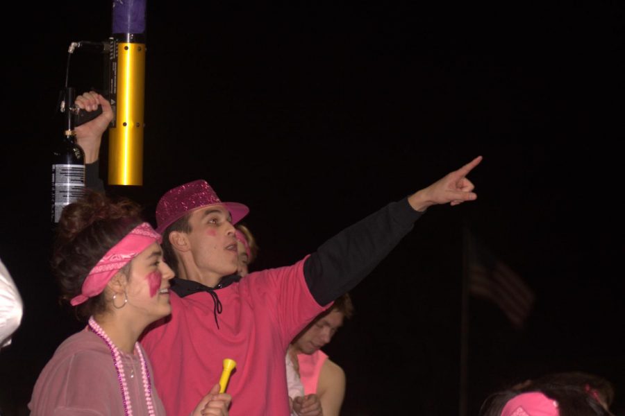 Ryan Lau ('22) preparing to shoot a t-shirt into an excited crowd.