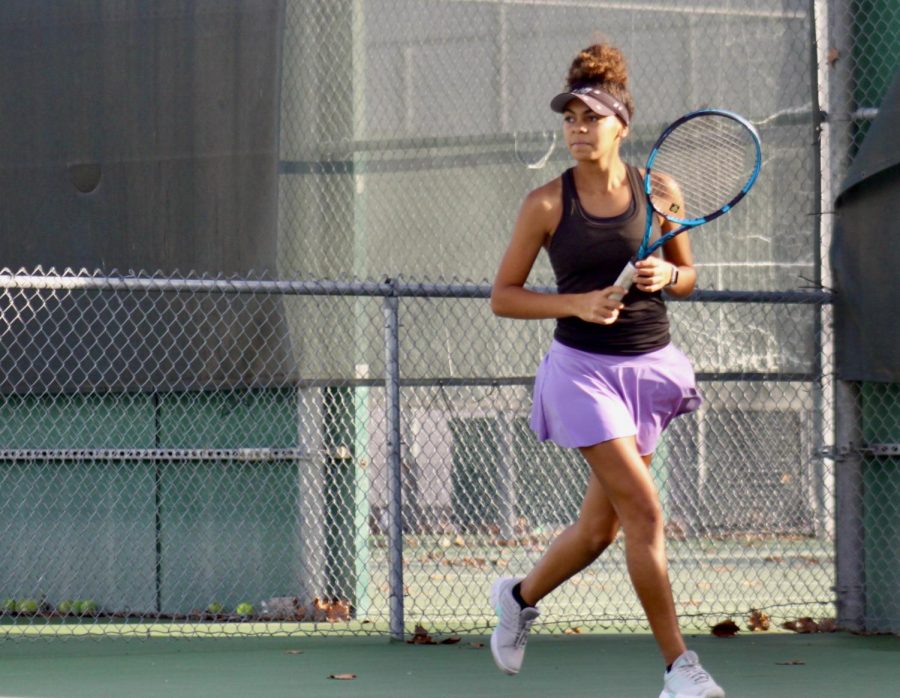 Montana Parkinson-Lubold ('24), runs to hit the ball.