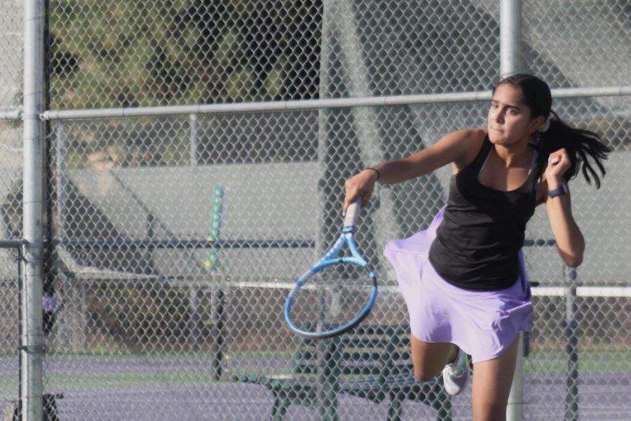 Neha Reddy ('24) smashes the ball, earning the point.