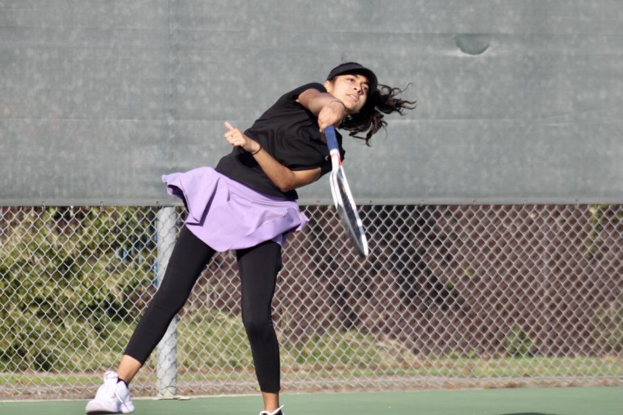 Maryam Suratwala ('22) hits a strong serve, starting off one of the rounds.