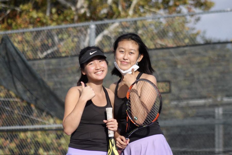 Hanna Min (22) and Hannah You (22) take a break before they start their game again.