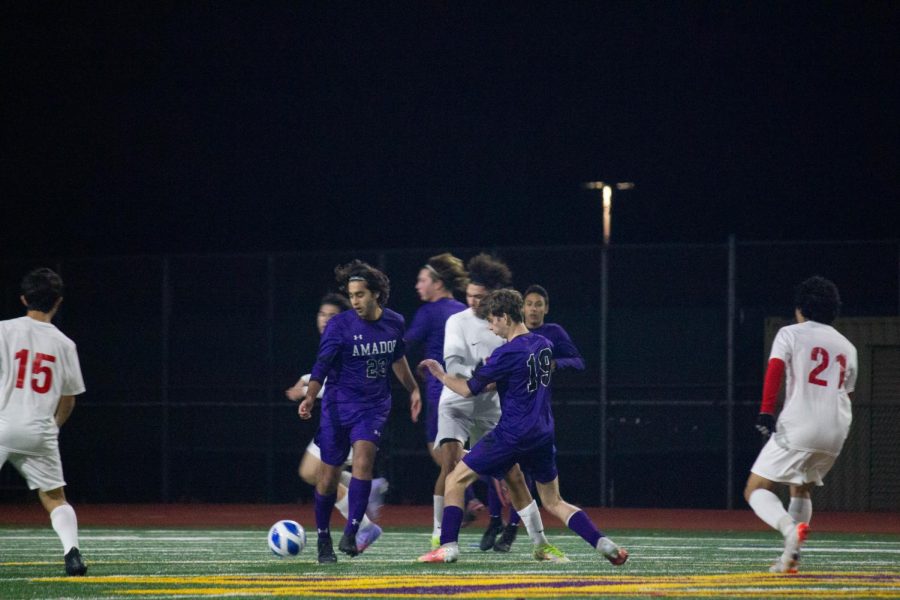 [From right to left] Saif Rajabali ('22) and Luke Atkinson ('22) guard against Livermore as they rush to capture the ball.