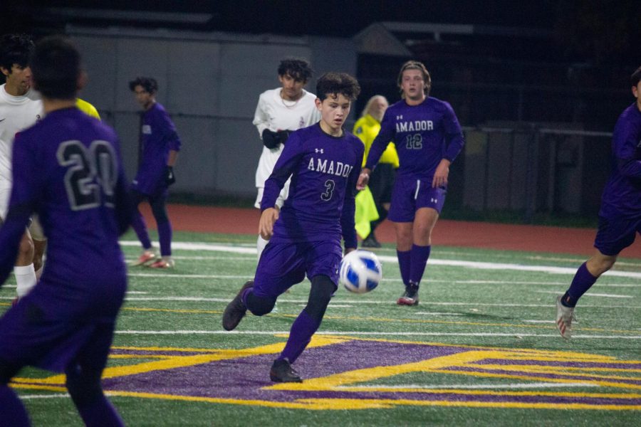 Kyle Larsen ('22) draws his leg back in preparation for a kick.
