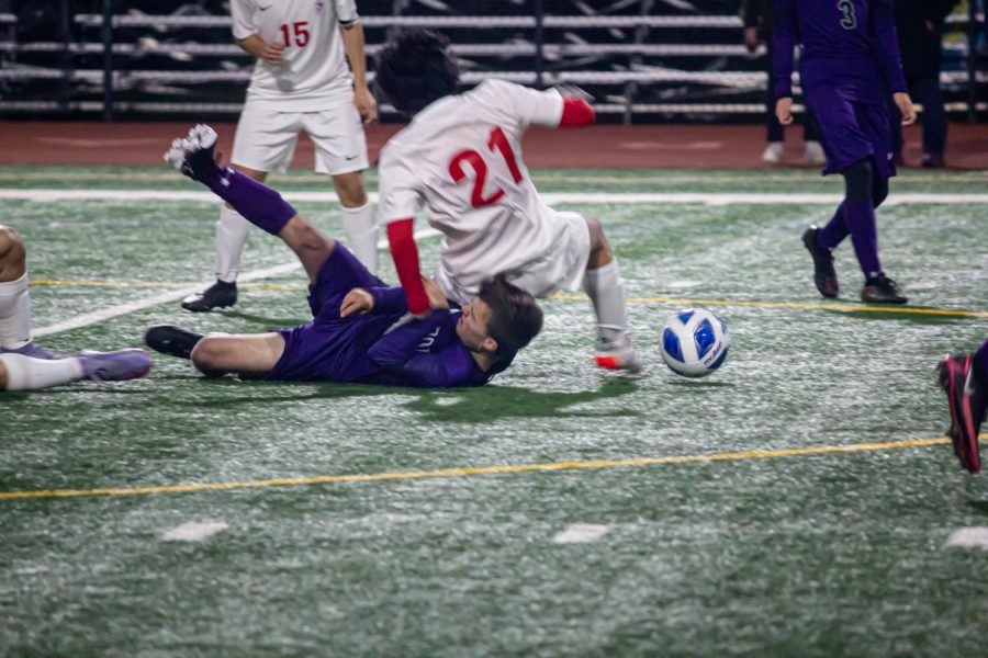 Jan Schullerus (24) crashes to the ground after sliding to protect the ball.
