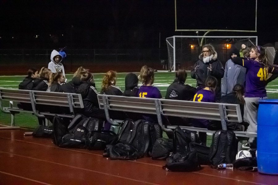 Sprinkling rain, high winds, and freezing temperatures forced the team to bundle up in long team coats during breaks.