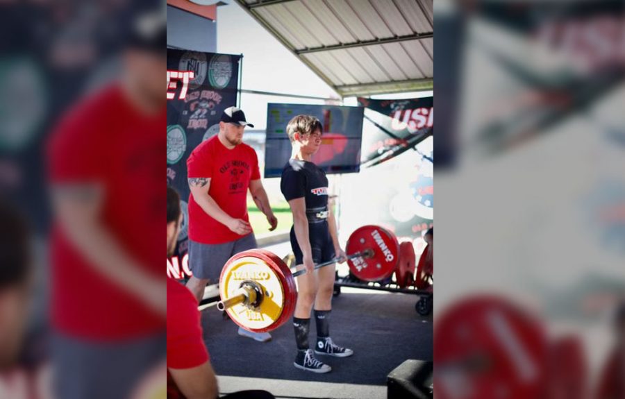 Sam Mah (23) competes in powerlifting