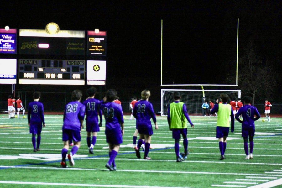 Amador’s varsity soccer team warms up for a match against Dublin High by working on ball handling and fast-paced passing drills.